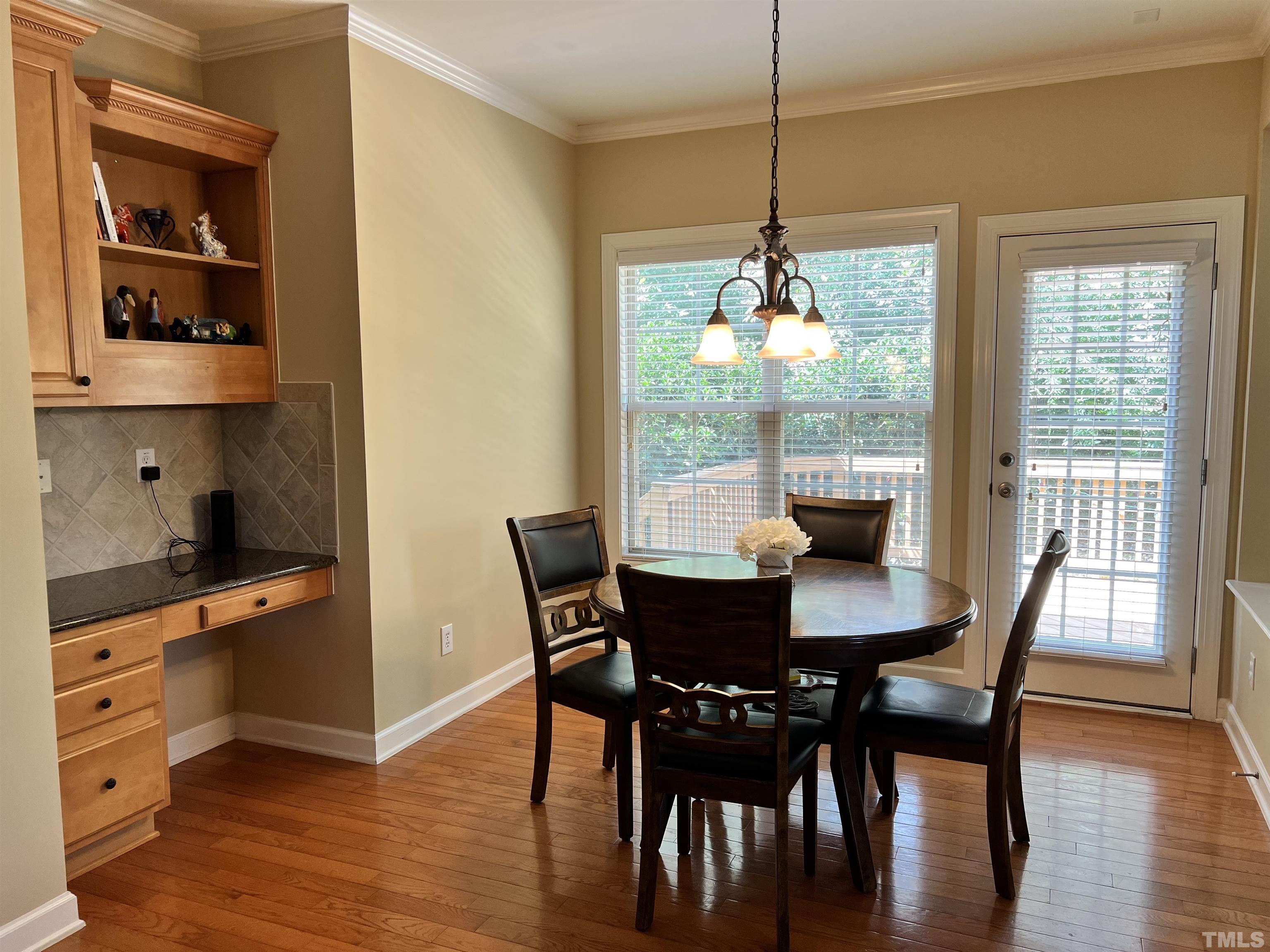 309 Parish House Road Cary, NC 27513 - Photo 9 of 33 a dining room with furniture window wooden floor