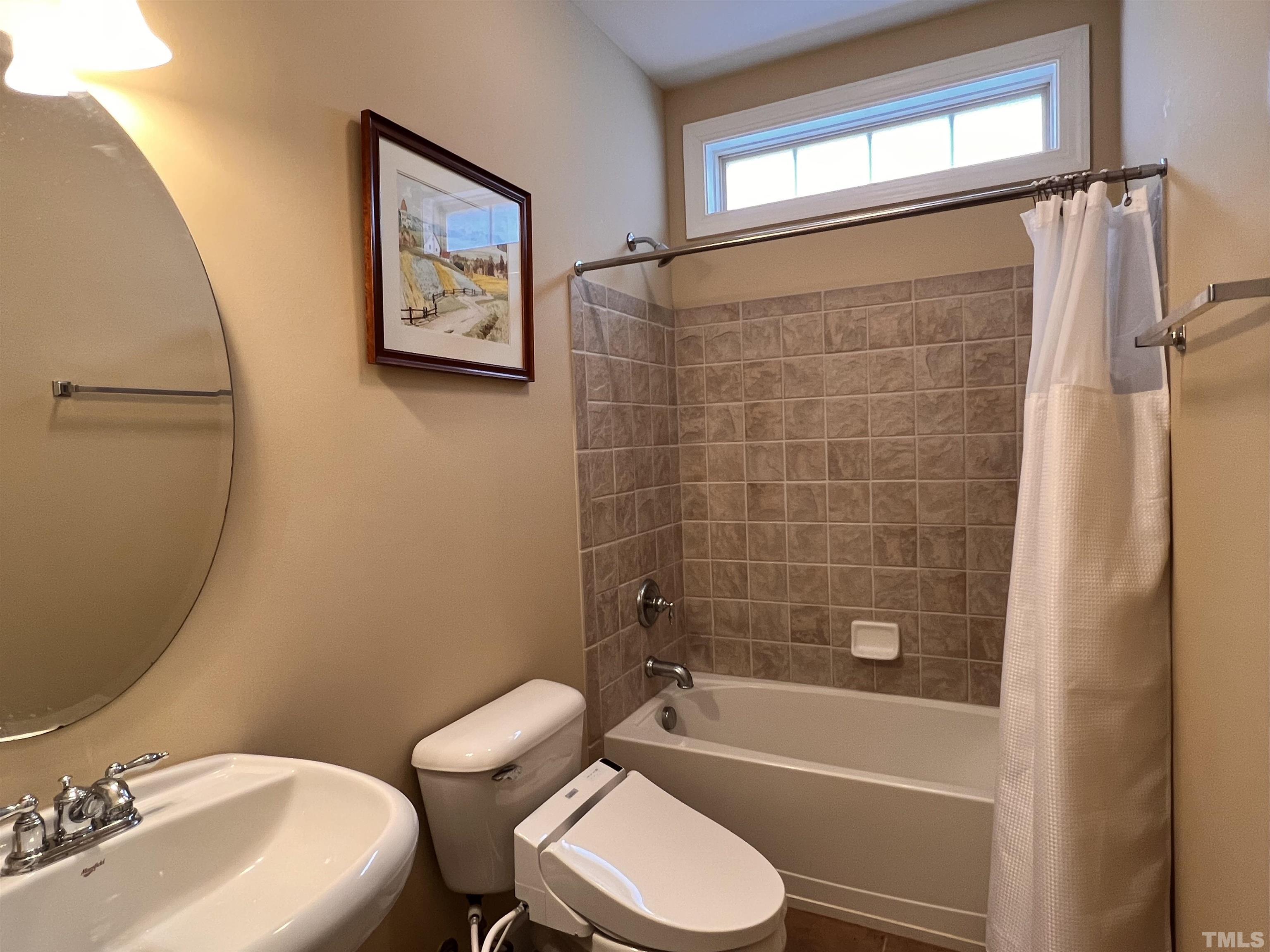 309 Parish House Road Cary, NC 27513 - Photo 10 of 33 a bathroom with a toilet a sink and bathtub