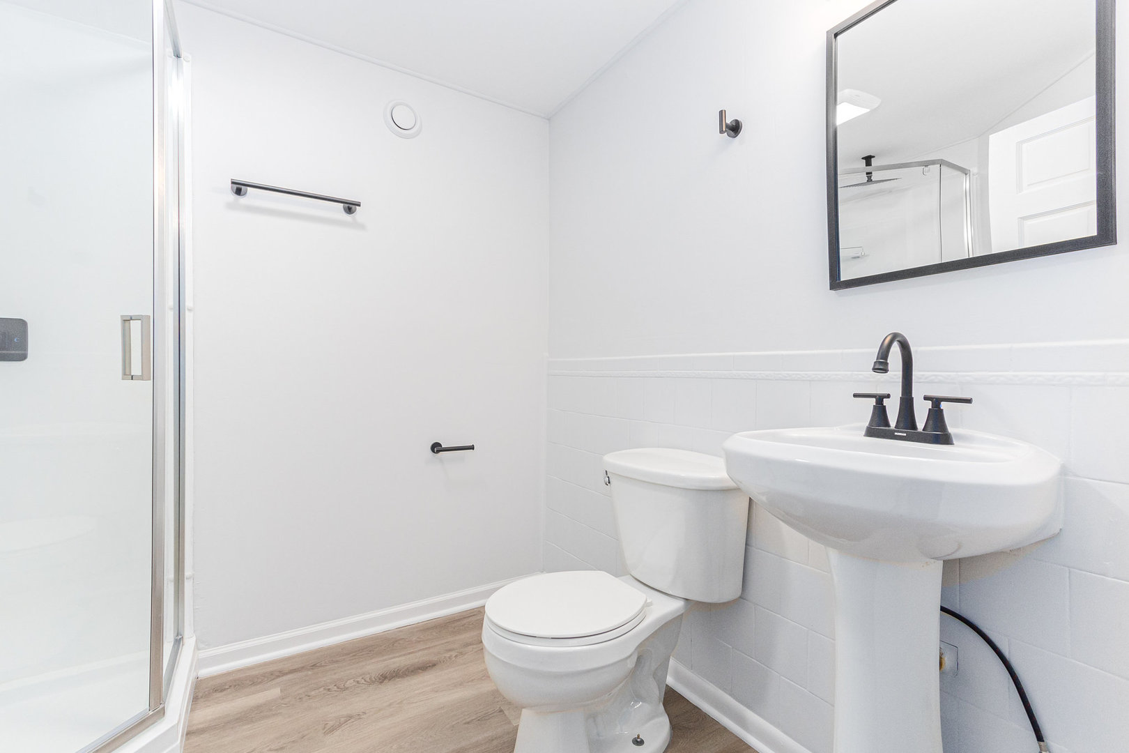 227 Hadleigh Road Bolingbrook, IL 60440 - Photo 14 of 19 a bathroom with a sink toilet and a mirror