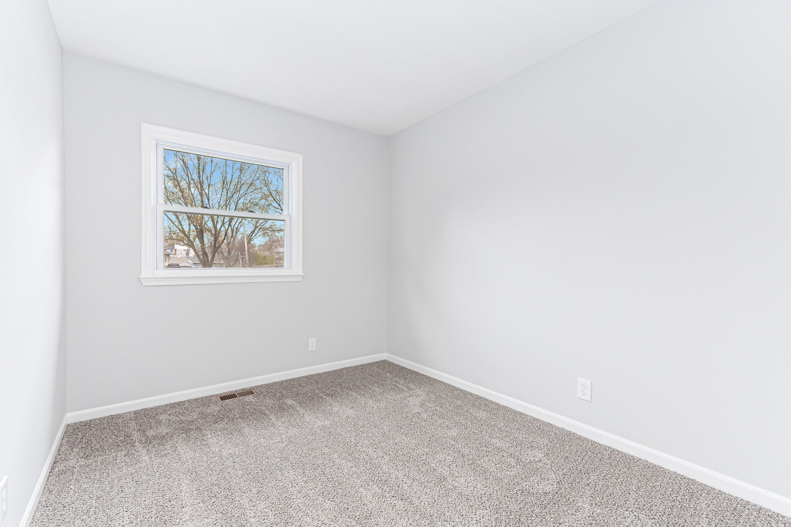 227 Hadleigh Road Bolingbrook, IL 60440 - Photo 8 of 19 an empty room with windows