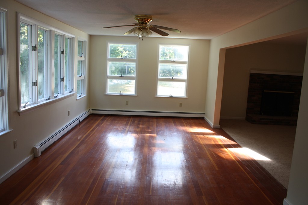 1985 South Athol Road Athol, MA 01331 - Photo 10 of 19 a view of empty room with wooden floor and fan