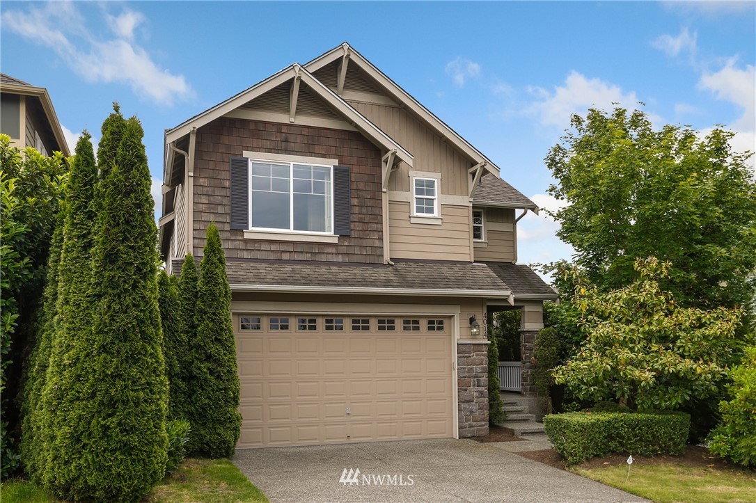 4014 167th Street Southeast Bothell, WA 98012 - Photo 1 of 39 a front view of a house with a garden