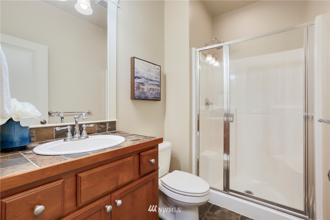 4014 167th Street Southeast Bothell, WA 98012 - Photo 18 of 39 a bathroom with a granite countertop sink toilet and shower