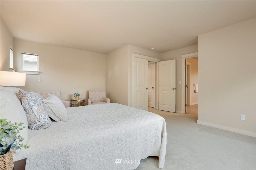 4014 167th Street Southeast Bothell, WA 98012 - Photo 22 of 39 a spacious bedroom with a bed and a closet