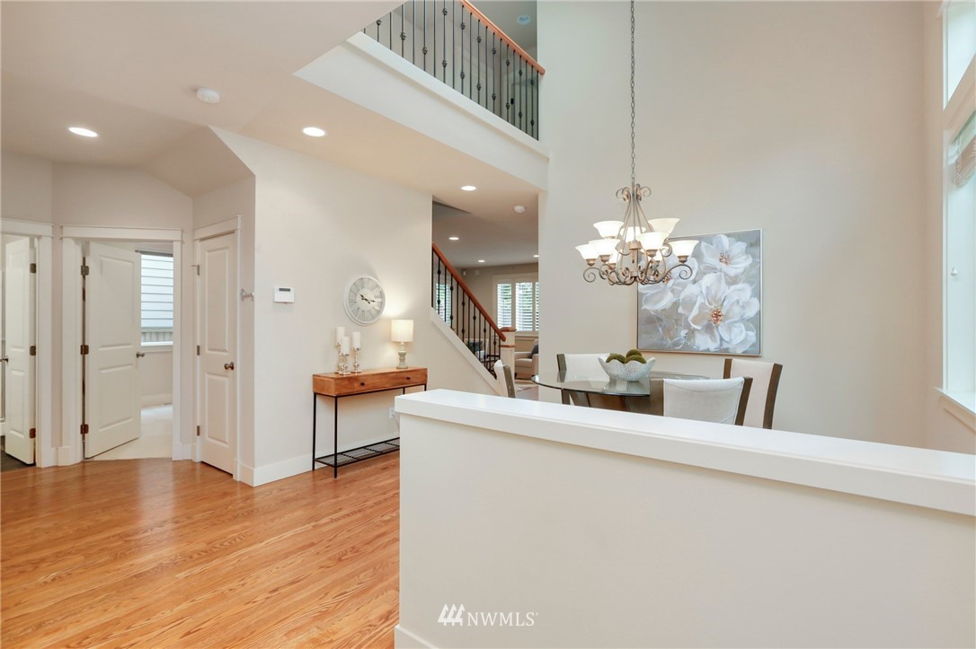 4014 167th Street Southeast Bothell, WA 98012 - Photo 4 of 39 a view of a living room with kitchen island stainless steel appliances wooden floor and living room view