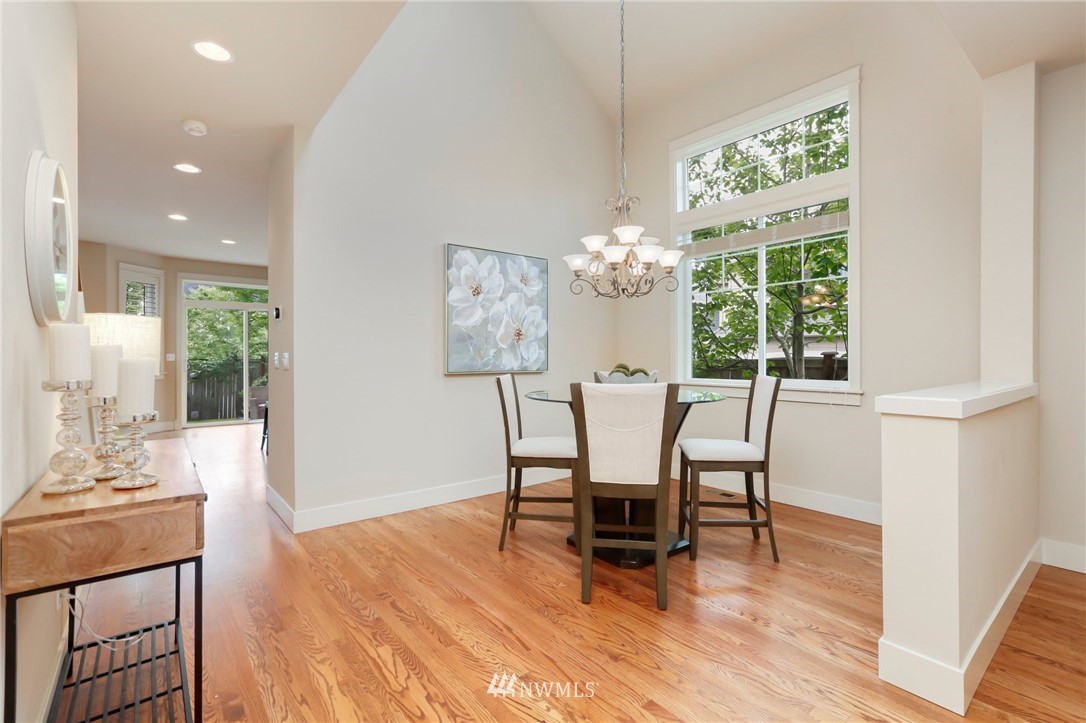 4014 167th Street Southeast Bothell, WA 98012 - Photo 5 of 39 a dining room with furniture a chandelier and wooden floor