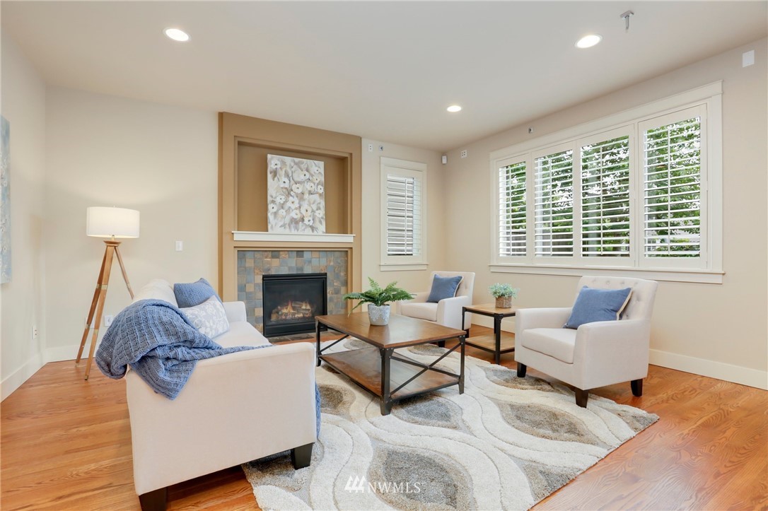 4014 167th Street Southeast Bothell, WA 98012 - Photo 8 of 39 a living room with furniture and a fireplace