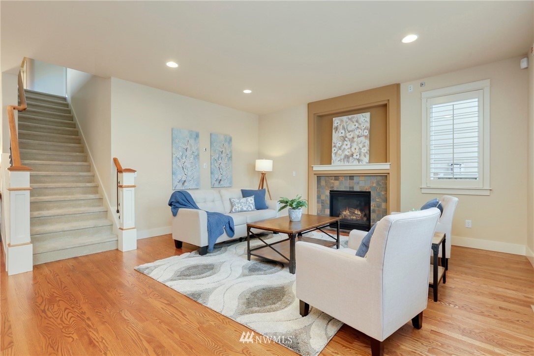 4014 167th Street Southeast Bothell, WA 98012 - Photo 9 of 39 a living room with furniture and a fireplace