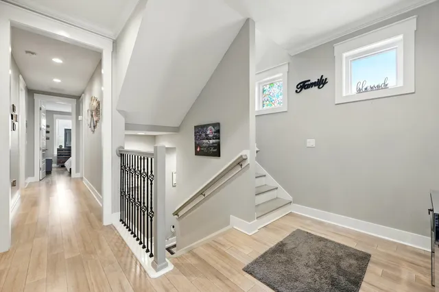 a view of a balcony with chair and wooden floor