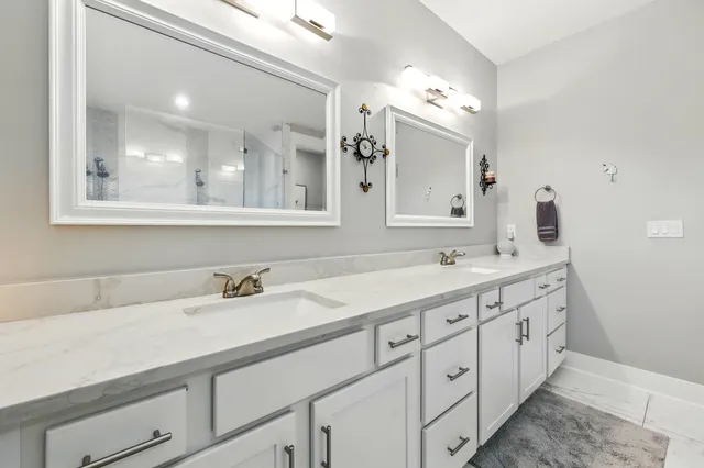 a kitchen with stainless steel appliances a stove a sink and a refrigerator