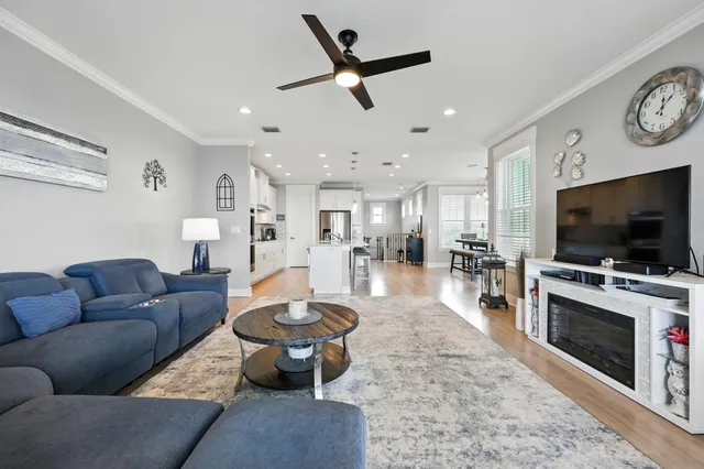 a front view of a house with a yard and trees