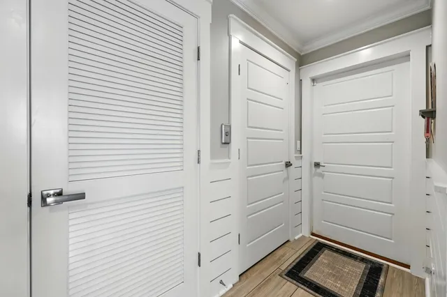an aerial view of a house with a big yard and large trees