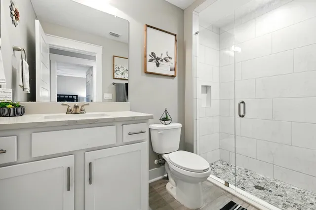 a view of entryway and hall with wooden floor