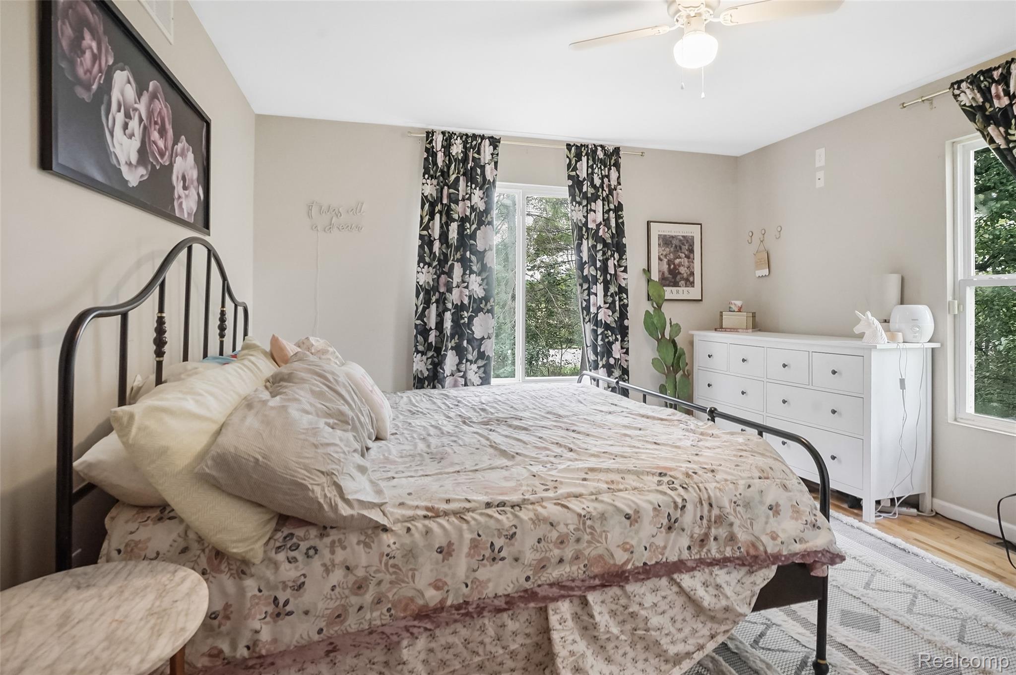 8330 Baldwin Road Gaines, MI 48436 - Photo 13 of 27 Room featuring a ceiling fan, light-toned wall paint, and a built-in window