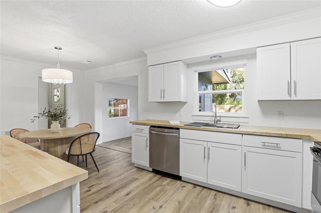 331 Northeast 2nd Street Williston, FL 32696 - Photo 13 of 29 a kitchen with a sink cabinets and window
