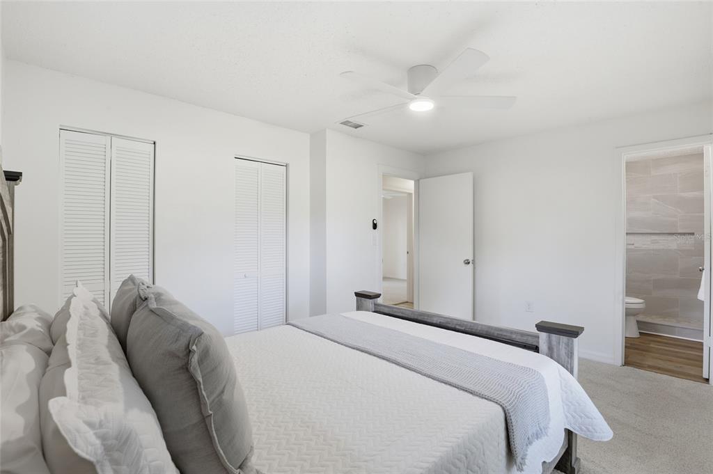 331 Northeast 2nd Street Williston, FL 32696 - Photo 22 of 29 a bedroom with a bed and a chair