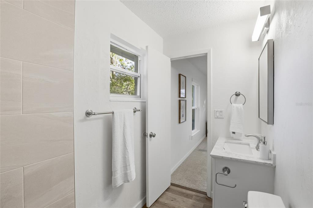 331 Northeast 2nd Street Williston, FL 32696 - Photo 23 of 29 a bathroom with a toilet sink and mirror
