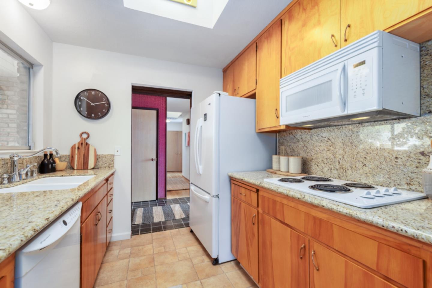 75 Simpson Drive Walnut Creek, CA 94596 - Photo 11 of 48 a kitchen with a sink stove and cabinets