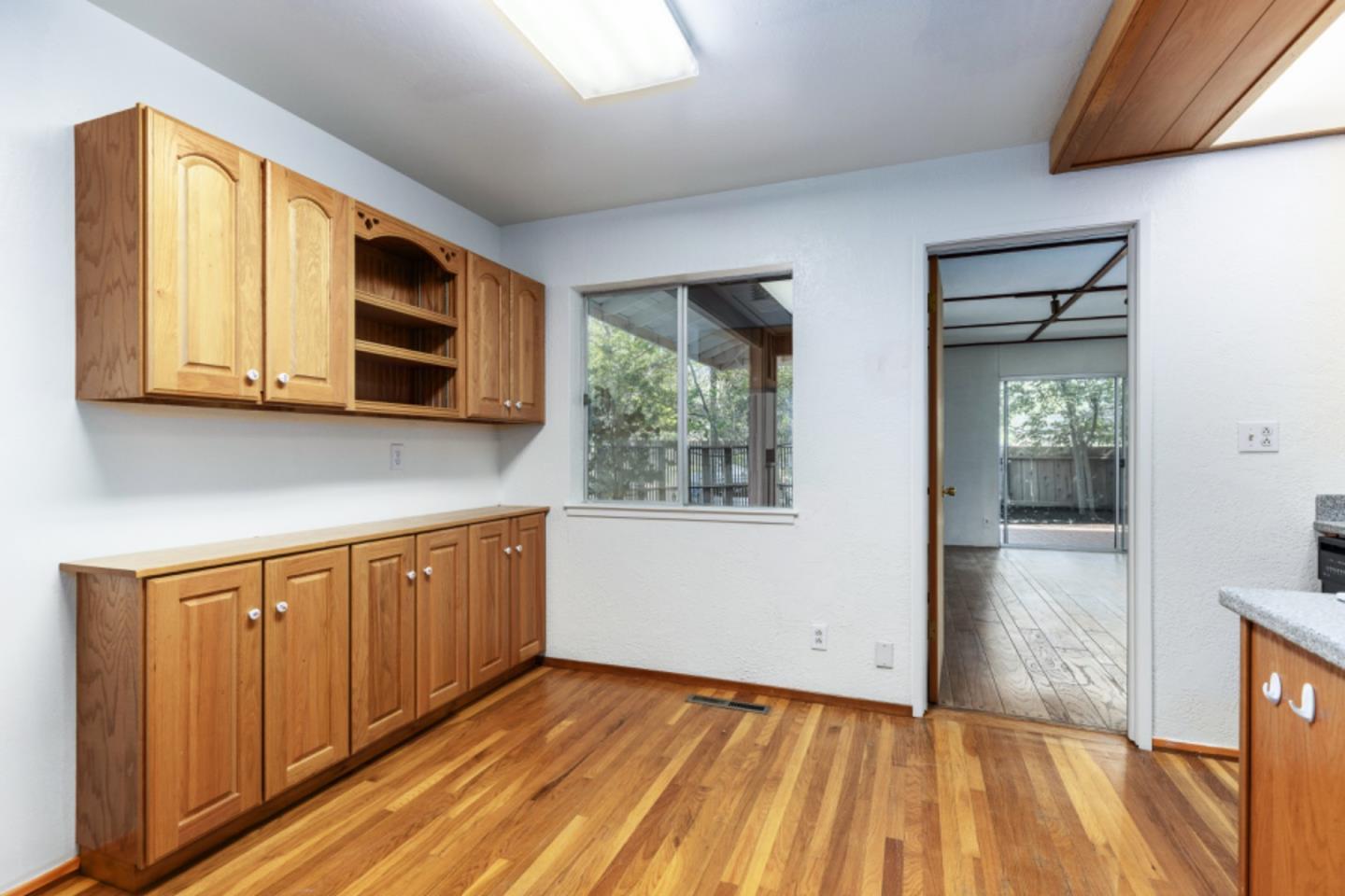 75 Simpson Drive Walnut Creek, CA 94596 - Photo 16 of 48 a view of a kitchen with wooden floor and electronic appliances