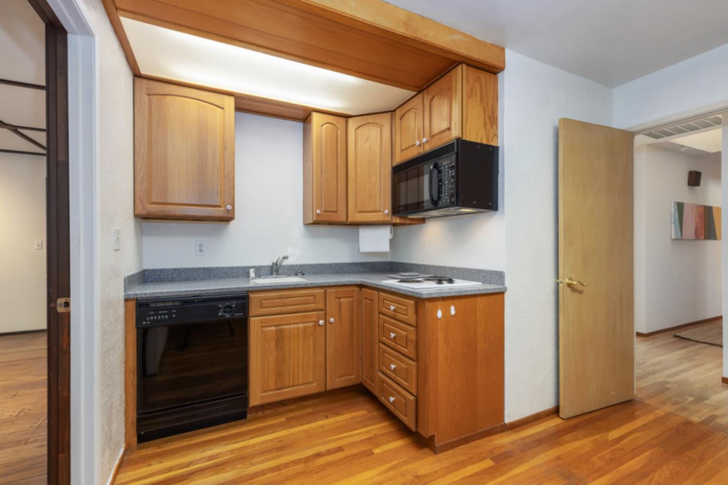 75 Simpson Drive Walnut Creek, CA 94596 - Photo 18 of 48 a kitchen with stainless steel appliances granite countertop a stove a microwave and a refrigerator