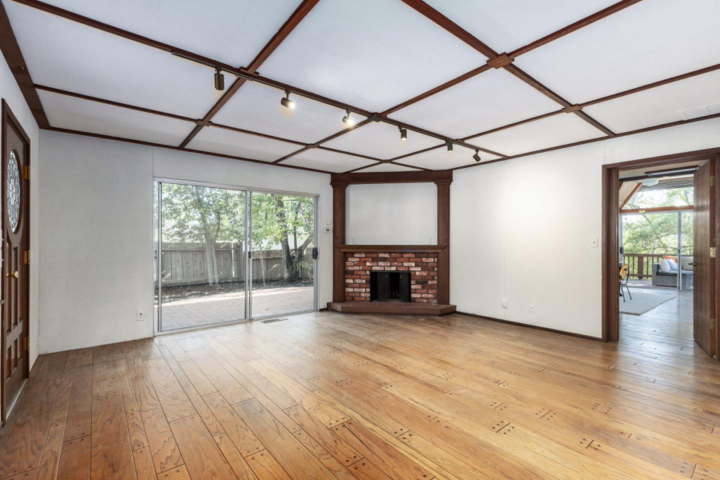 75 Simpson Drive Walnut Creek, CA 94596 - Photo 19 of 48 a view of empty room with wooden floor and fireplace