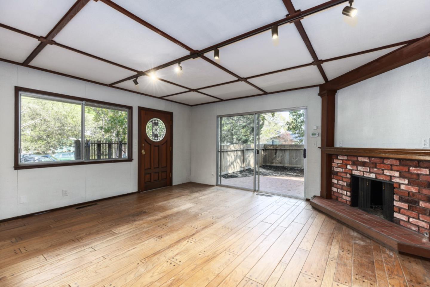 75 Simpson Drive Walnut Creek, CA 94596 - Photo 20 of 48 a view of empty room with wooden floor and fireplace