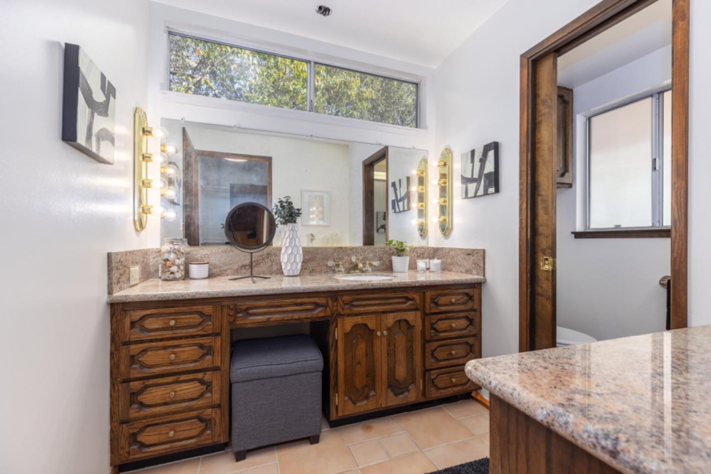75 Simpson Drive Walnut Creek, CA 94596 - Photo 37 of 48 a bathroom with a granite countertop sink and a mirror