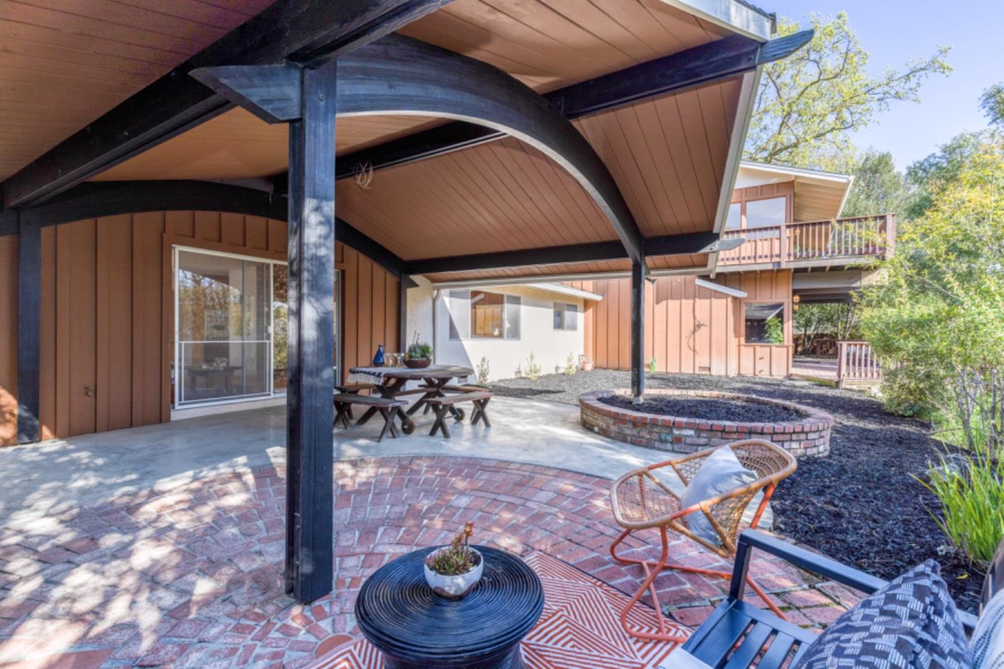 75 Simpson Drive Walnut Creek, CA 94596 - Photo 47 of 48 a view of a patio with table and chairs potted plants and floor to ceiling window