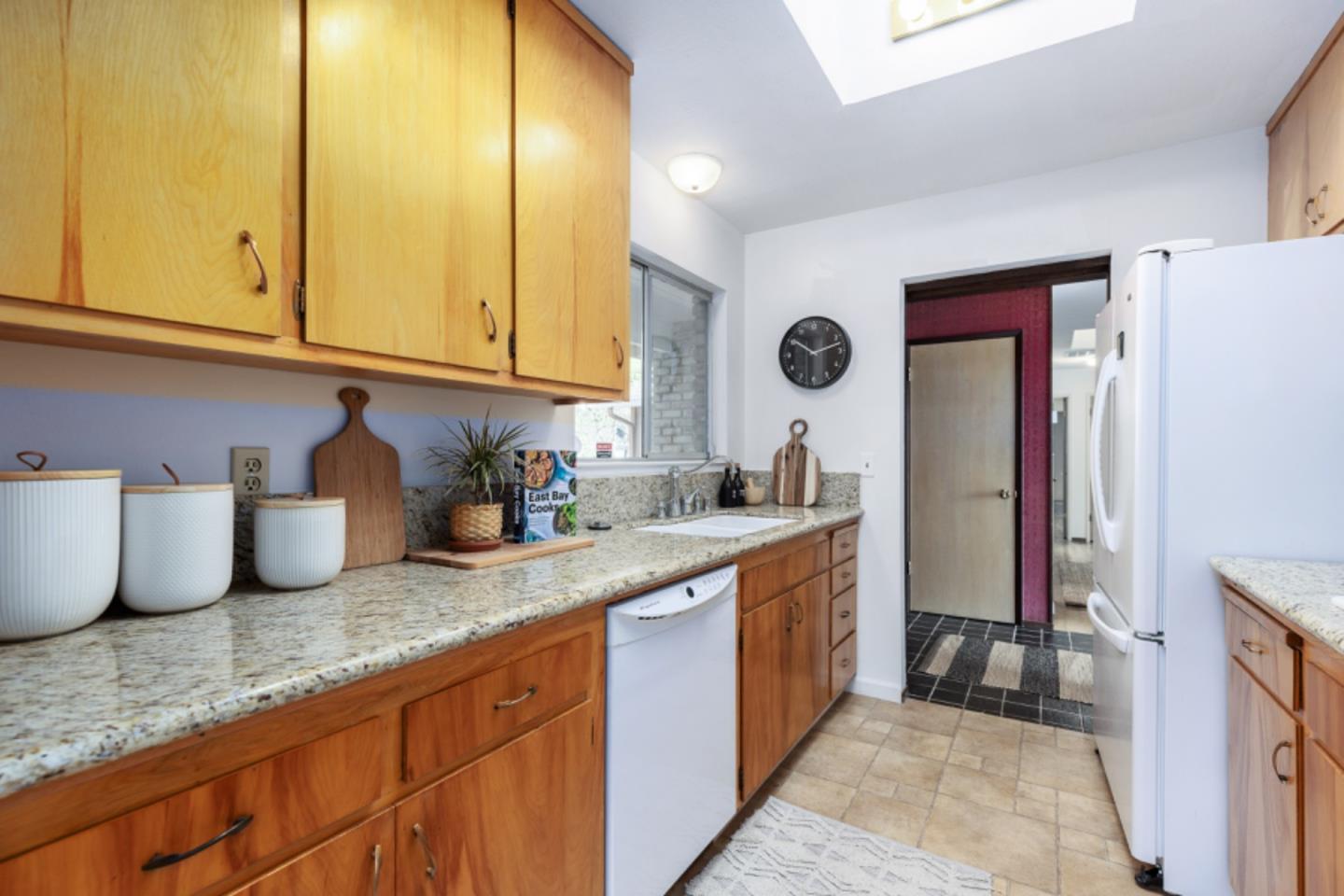 75 Simpson Drive Walnut Creek, CA 94596 - Photo 10 of 48 a kitchen with granite countertop a sink a stove and cabinets
