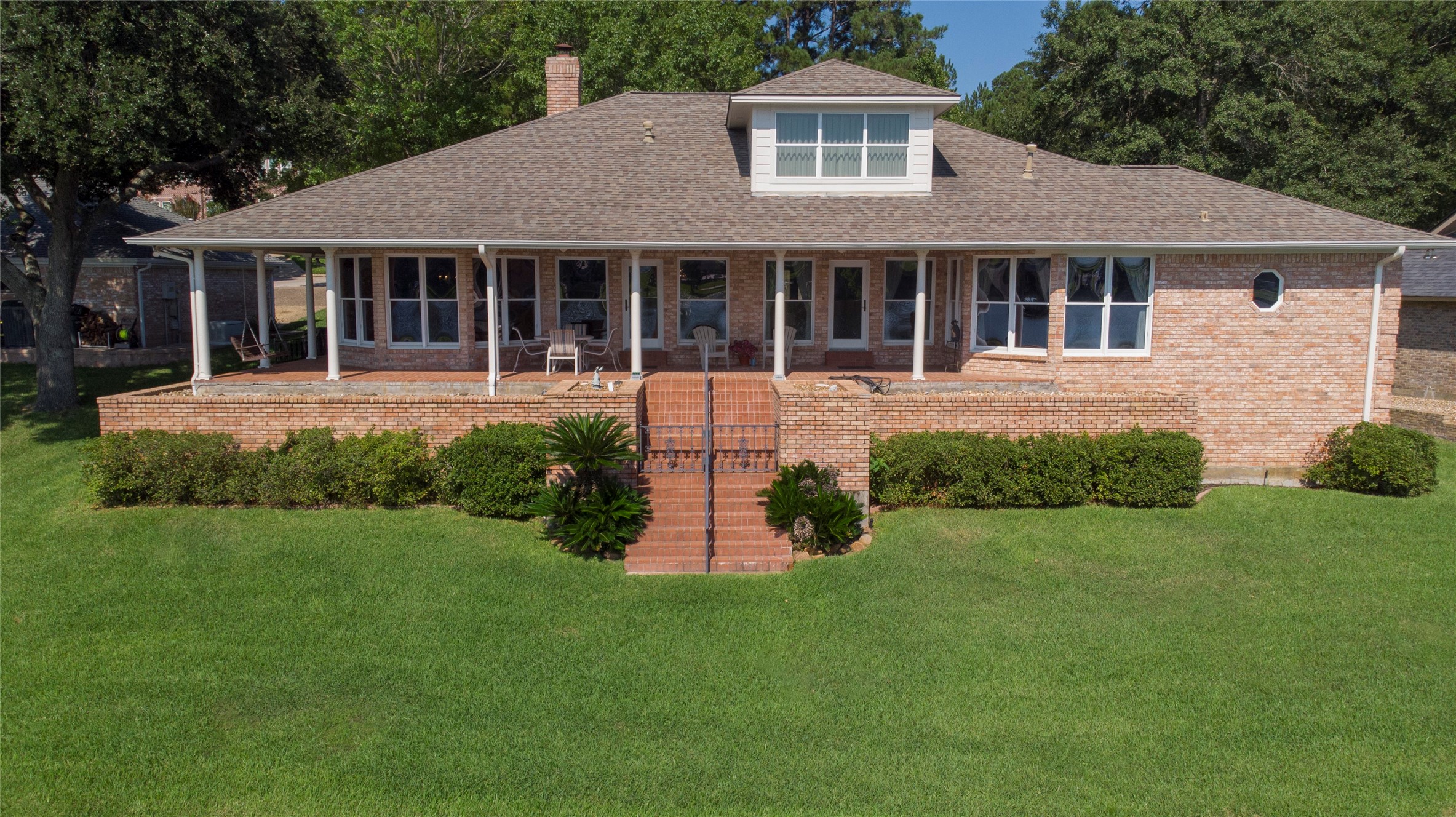 2008 Wickersham Drive Huntsville, TX 77340 - Photo 14 of 49 a front view of a house with a yard and porch