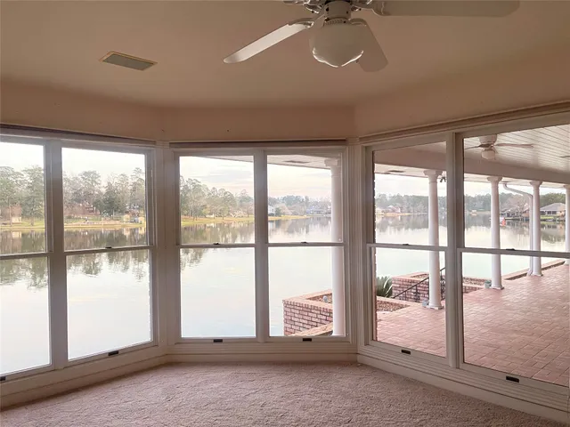 a spacious bathroom with a granite countertop sink a mirror a shower and a bathtub