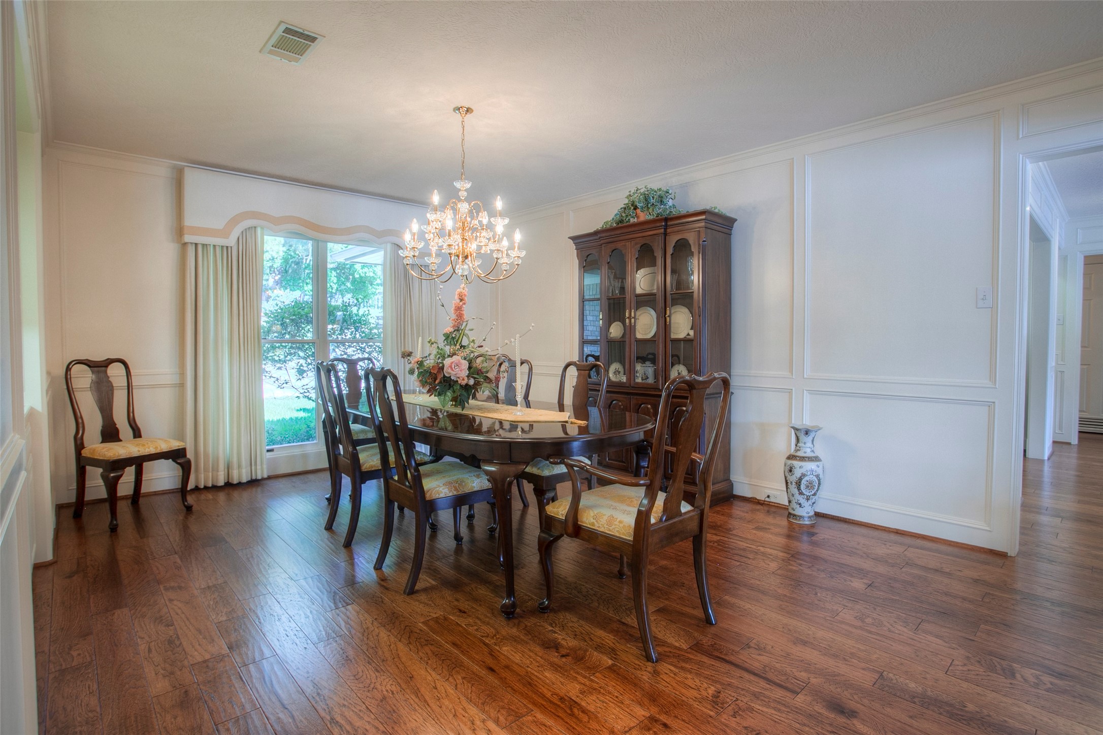 2008 Wickersham Drive Huntsville, TX 77340 - Photo 28 of 49 a view of a dining room with furniture and wooden floor