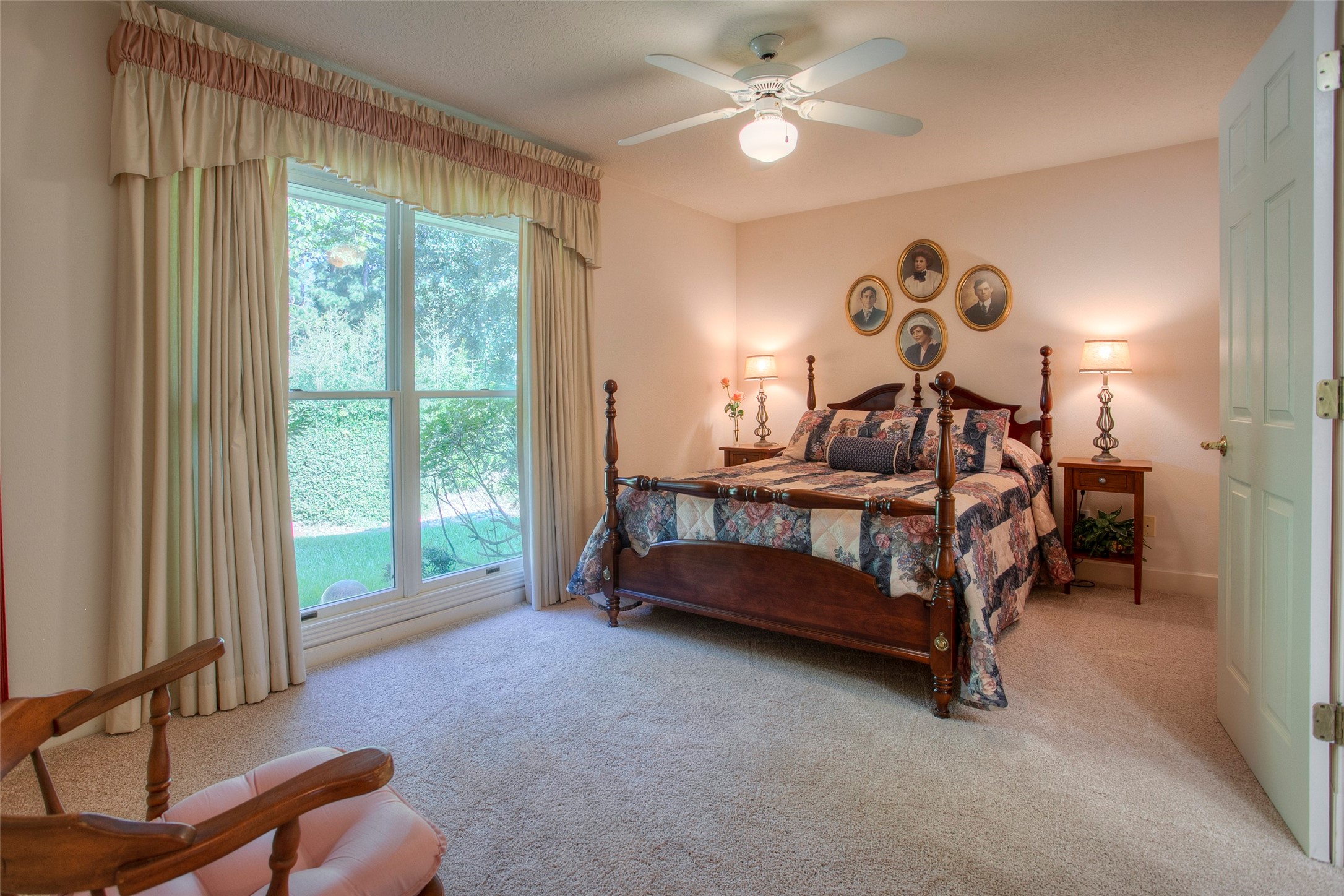 2008 Wickersham Drive Huntsville, TX 77340 - Photo 34 of 49 a bedroom with a bed and a chandelier