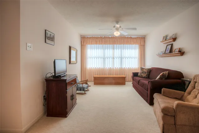 a living room with furniture and a window