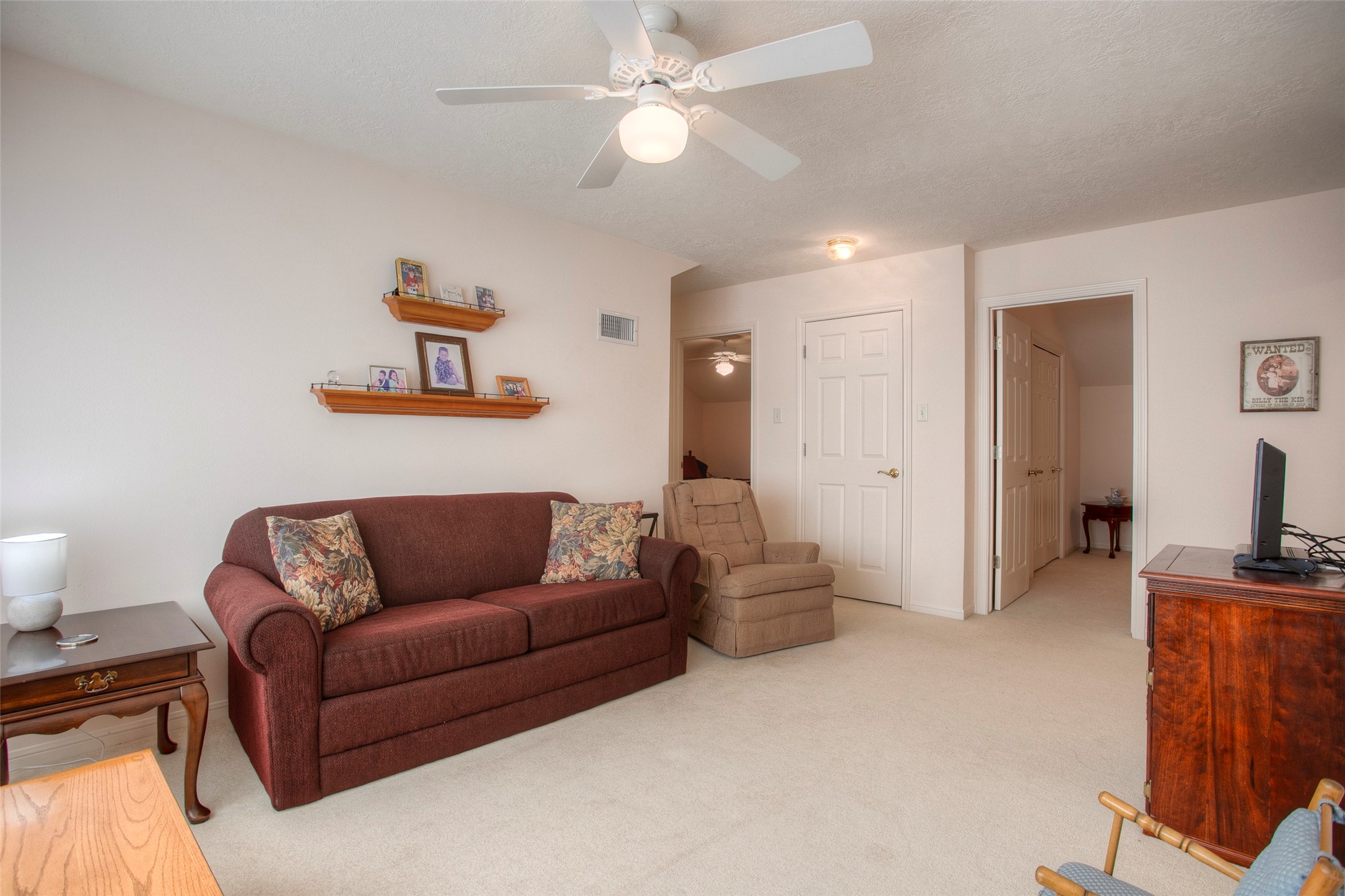 2008 Wickersham Drive Huntsville, TX 77340 - Photo 40 of 49 a living room with furniture and a flat screen tv