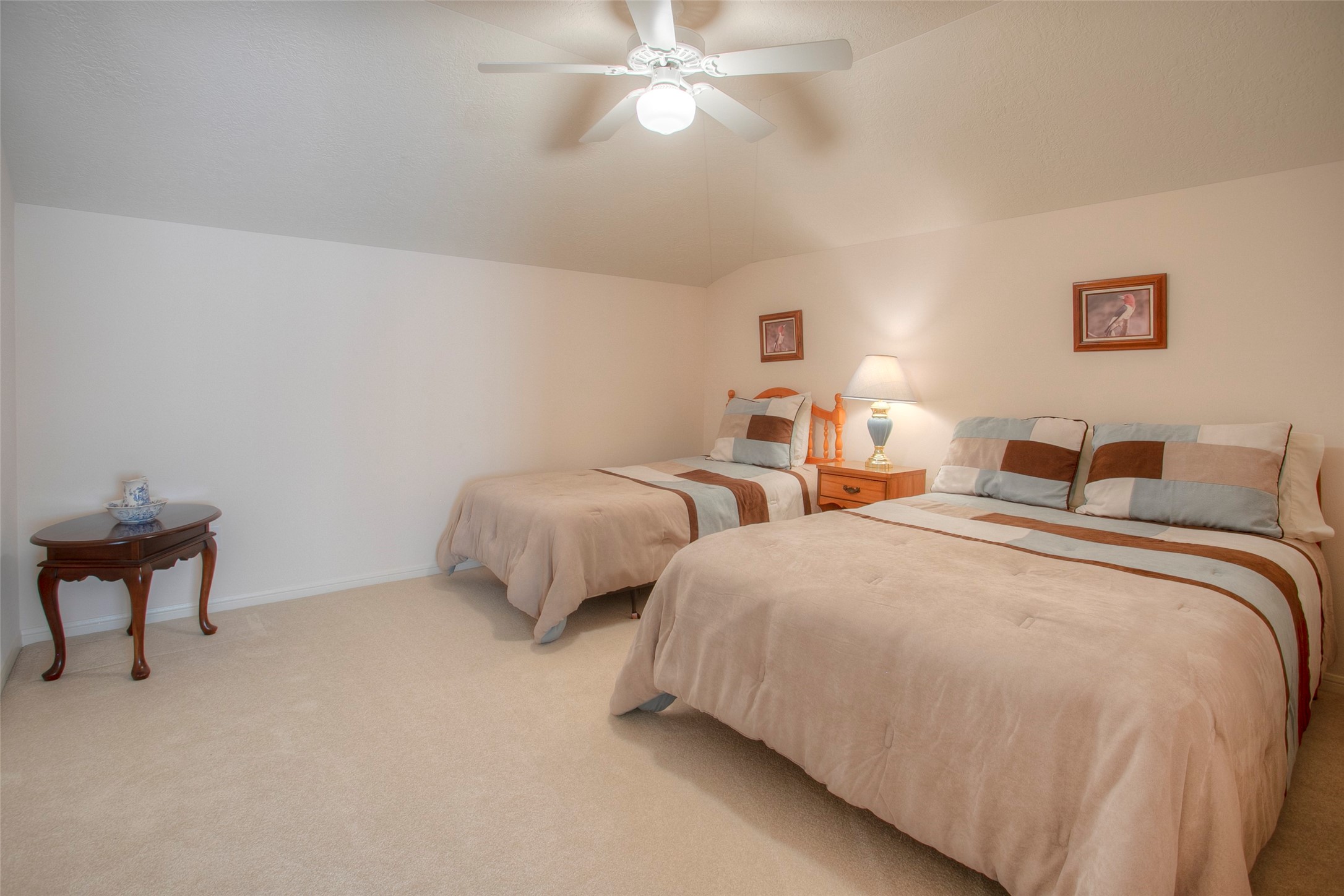 2008 Wickersham Drive Huntsville, TX 77340 - Photo 42 of 49 a bedroom with two beds and painting on the wall