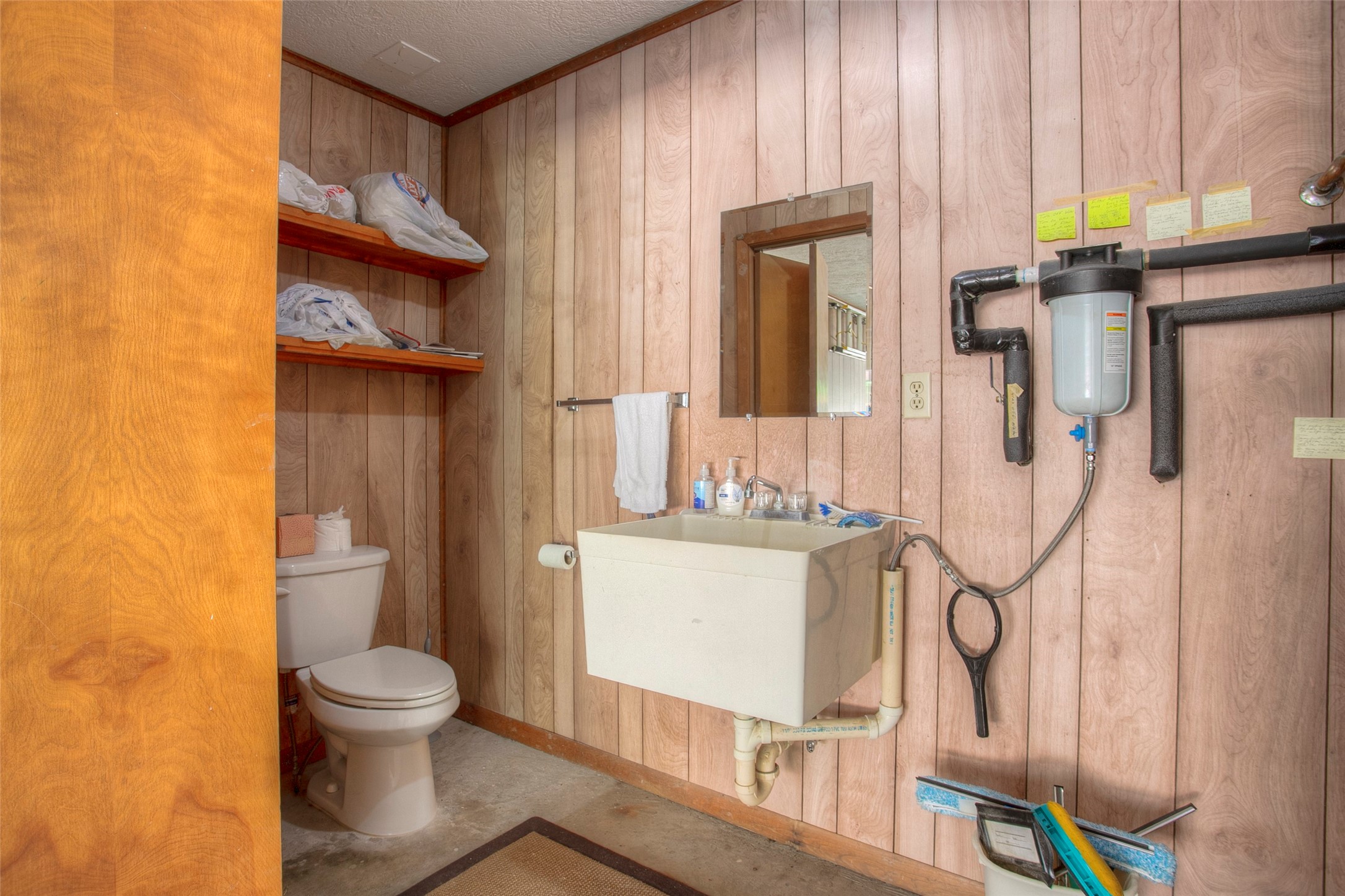 2008 Wickersham Drive Huntsville, TX 77340 - Photo 47 of 49 a bathroom with a granite countertop toilet and a sink