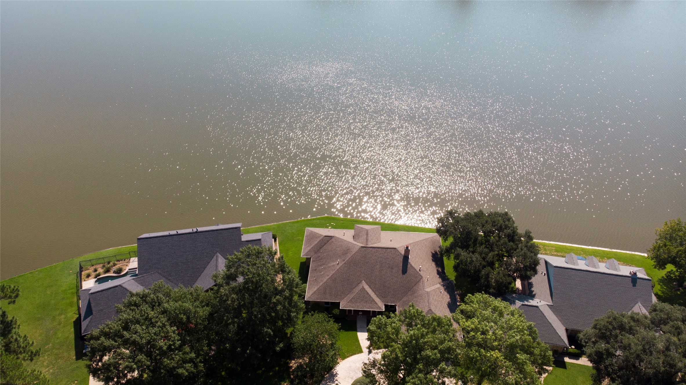 2008 Wickersham Drive Huntsville, TX 77340 - Photo 49 of 49 an aerial view of a house with plants and large trees