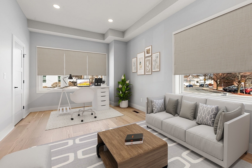 312 Newton Street, Unit 1A Waltham, MA 02453 - Photo 16 of 32 a living room with furniture and a table