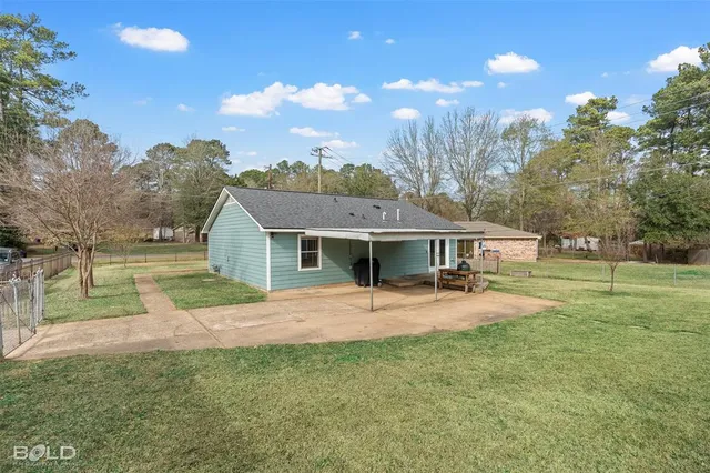 a house view with a backyard space