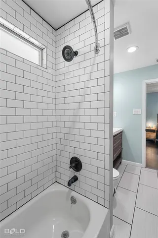 a bathroom with a sink and a shower