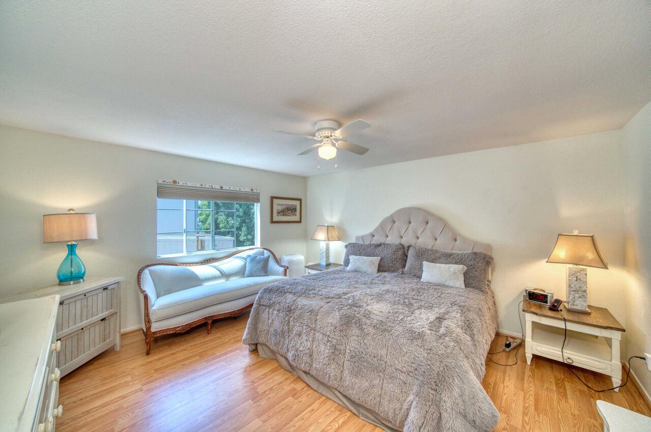 5 Lighthouse Road, Unit 5 Half Moon Bay, CA 94019 - Photo 13 of 25 a bed room with a bed and a couch