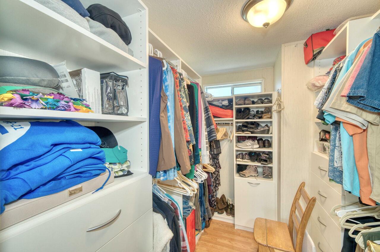 5 Lighthouse Road, Unit 5 Half Moon Bay, CA 94019 - Photo 16 of 25 a bedroom with a bed and a book shelf