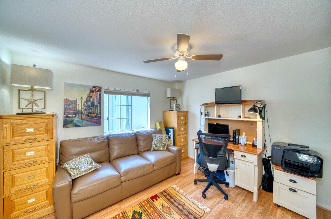 5 Lighthouse Road, Unit 5 Half Moon Bay, CA 94019 - Photo 18 of 25 a living room with furniture and a flat screen tv