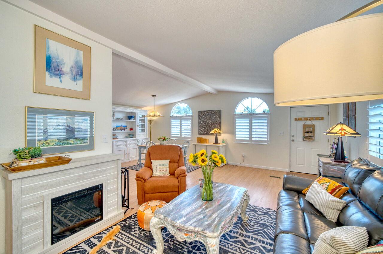 5 Lighthouse Road, Unit 5 Half Moon Bay, CA 94019 - Photo 4 of 25 a living room with furniture fireplace and a window