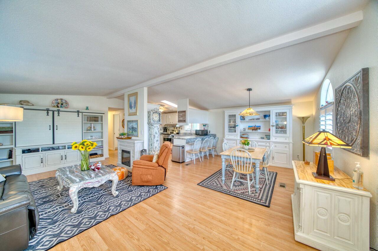 5 Lighthouse Road, Unit 5 Half Moon Bay, CA 94019 - Photo 5 of 25 a living room with furniture and a wooden floor