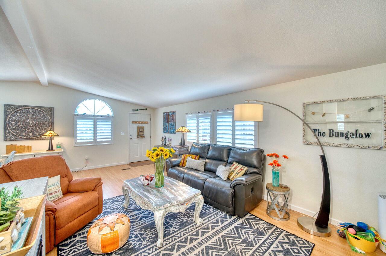 5 Lighthouse Road, Unit 5 Half Moon Bay, CA 94019 - Photo 6 of 25 a living room with furniture and a table