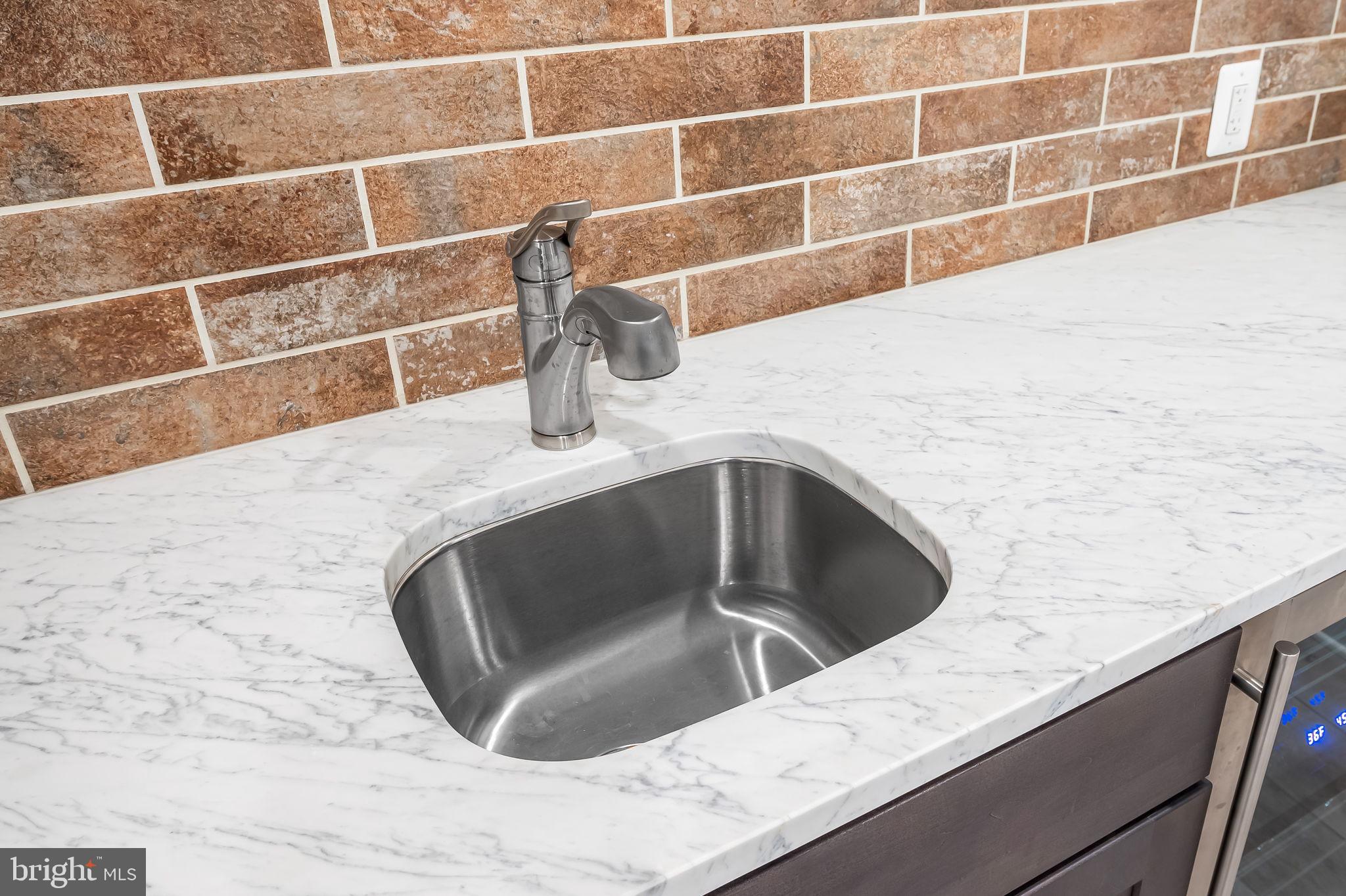 1671 Bay Head Road Annapolis, MD 21409 - Photo 44 of 56 Carrara marble wet bar w/tile feature wall