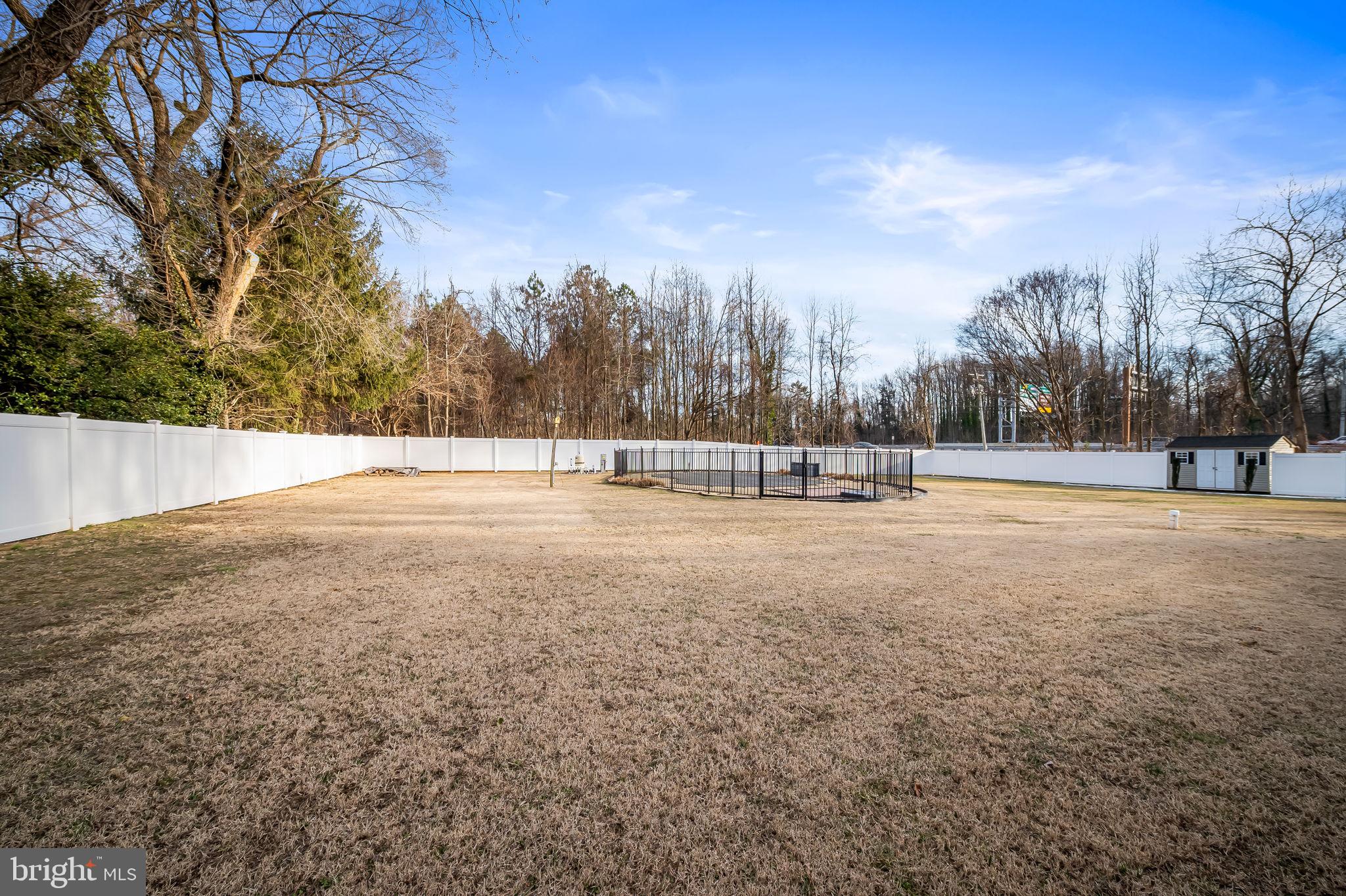 1671 Bay Head Road Annapolis, MD 21409 - Photo 55 of 56 6ft vinyl privacy fence around perimeter of yard