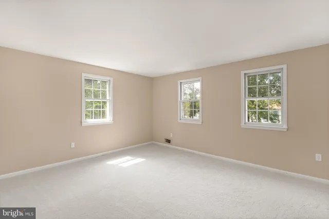 an empty room with windows